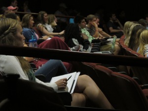 Students look on as the screening begins.